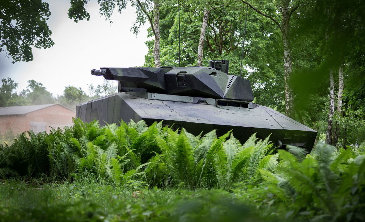 tank behind grasses