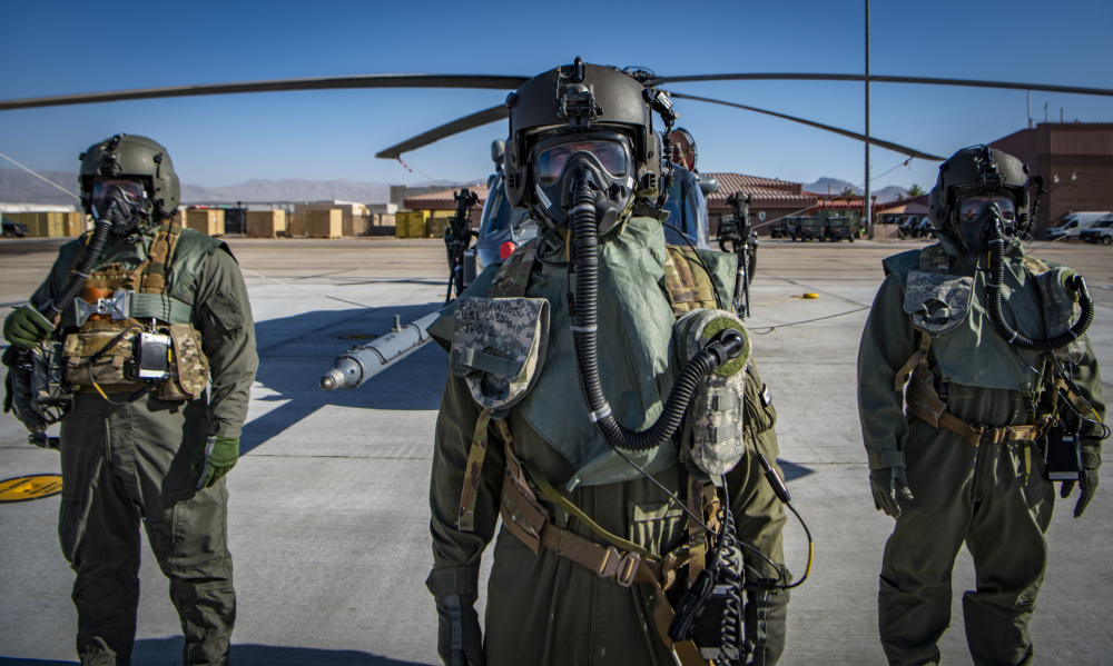 Airmen assigned to the 88th Test and Evaluation Squadron, pose for a photo in full Chemical, Biological, Radiological, and Nuclear flight gear