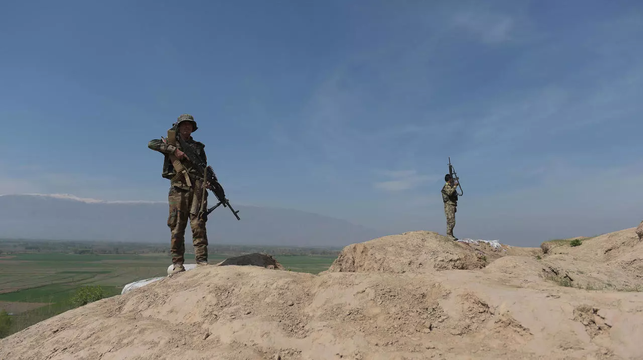 Afghan National Army soldiers keep watch in Dand-e-Ghori district in Baghlan province on March 15, 2016, following weeks of heavy battles to recapture the area from Taliban militants