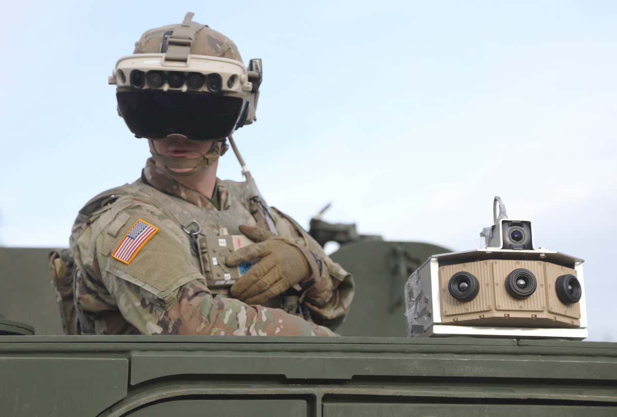 A soldier dons the Integrated Visual Augmentation System Capability Set 3 hardware while mounted on a Stryker at Joint Base Lewis-McCord, Washington, in January 2021