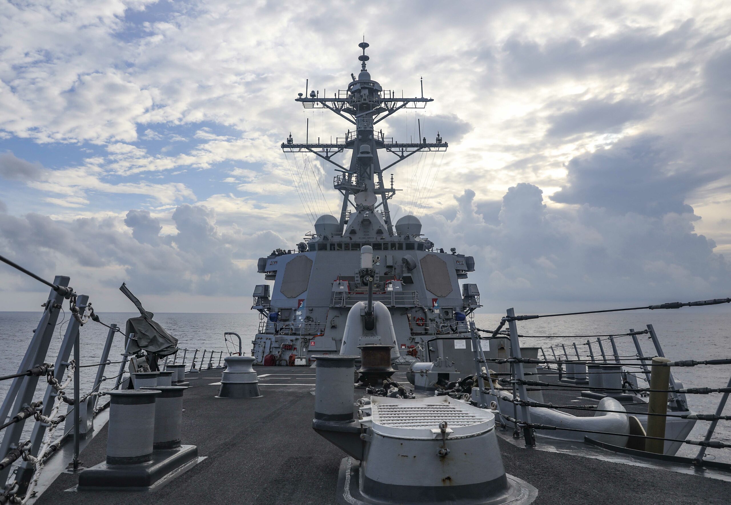 The Arleigh Burke-class guided-missile destroyer USS Benfold (DDG 65) sails through the South China Sea while conducting routine underway operations