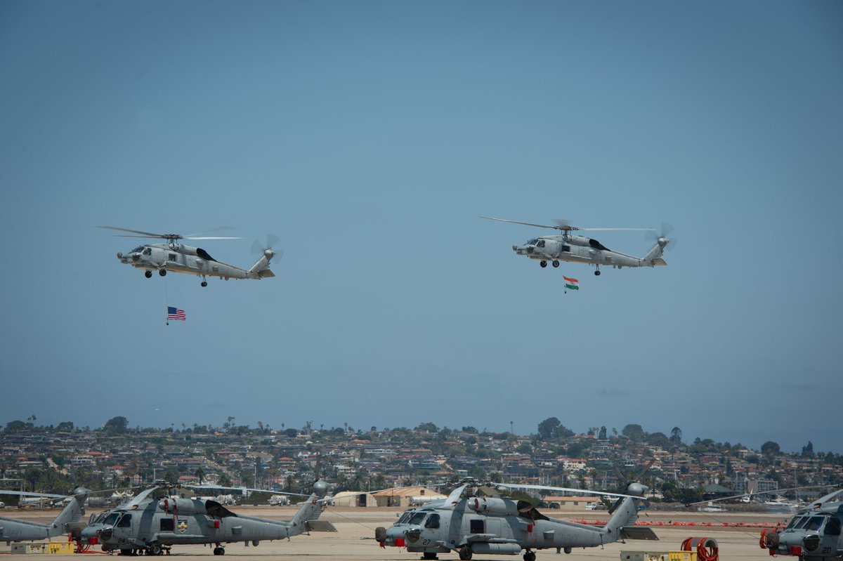 Two MH-60R Seahawks helicopters participated in a formation flyover during a ceremony where the Indian Navy received its first two MH-60Rs from the US Navy