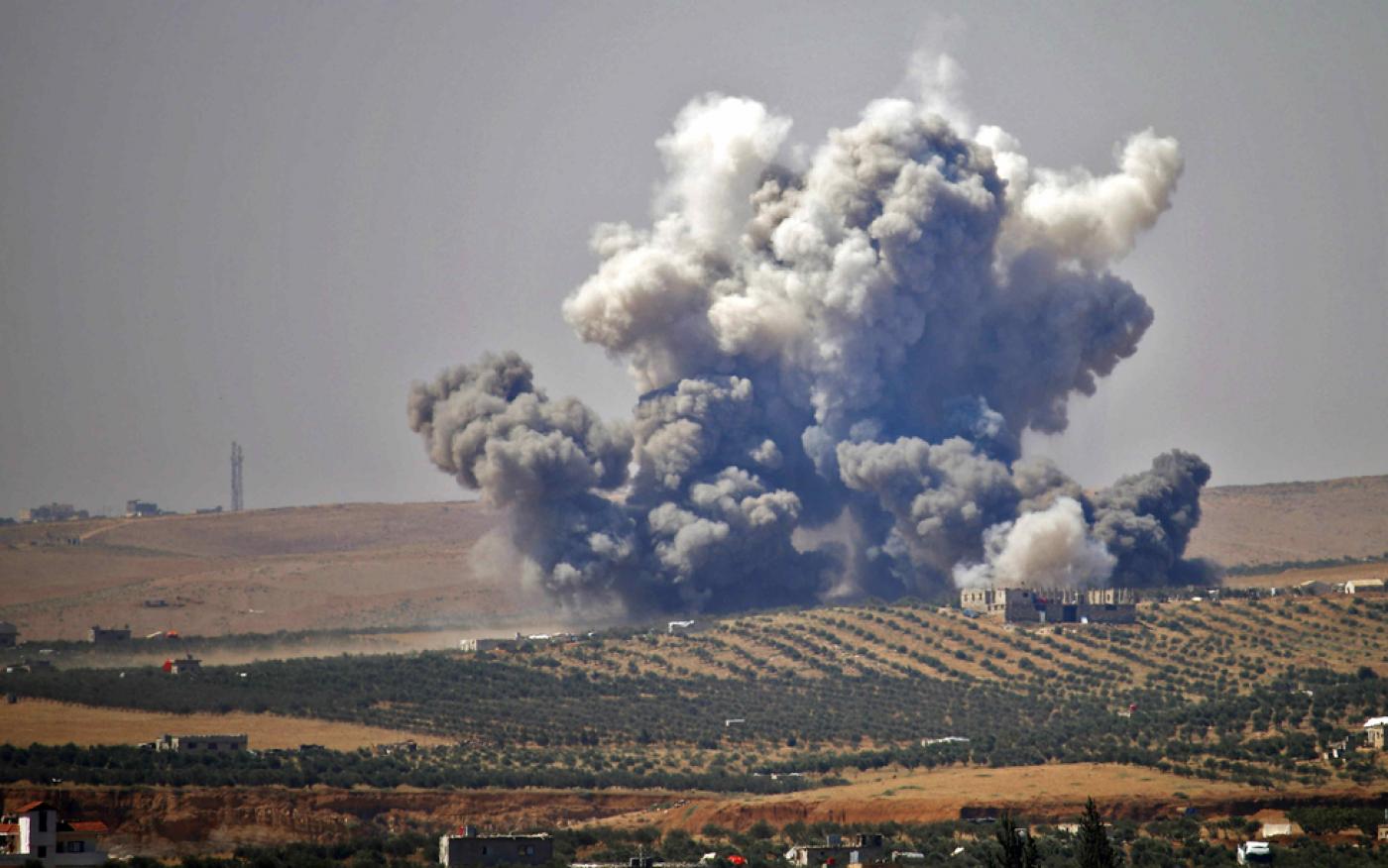 An air strike, reportedly by Syrian regime forces, hits rebel-held areas of the city of Daraa in southern Syrian