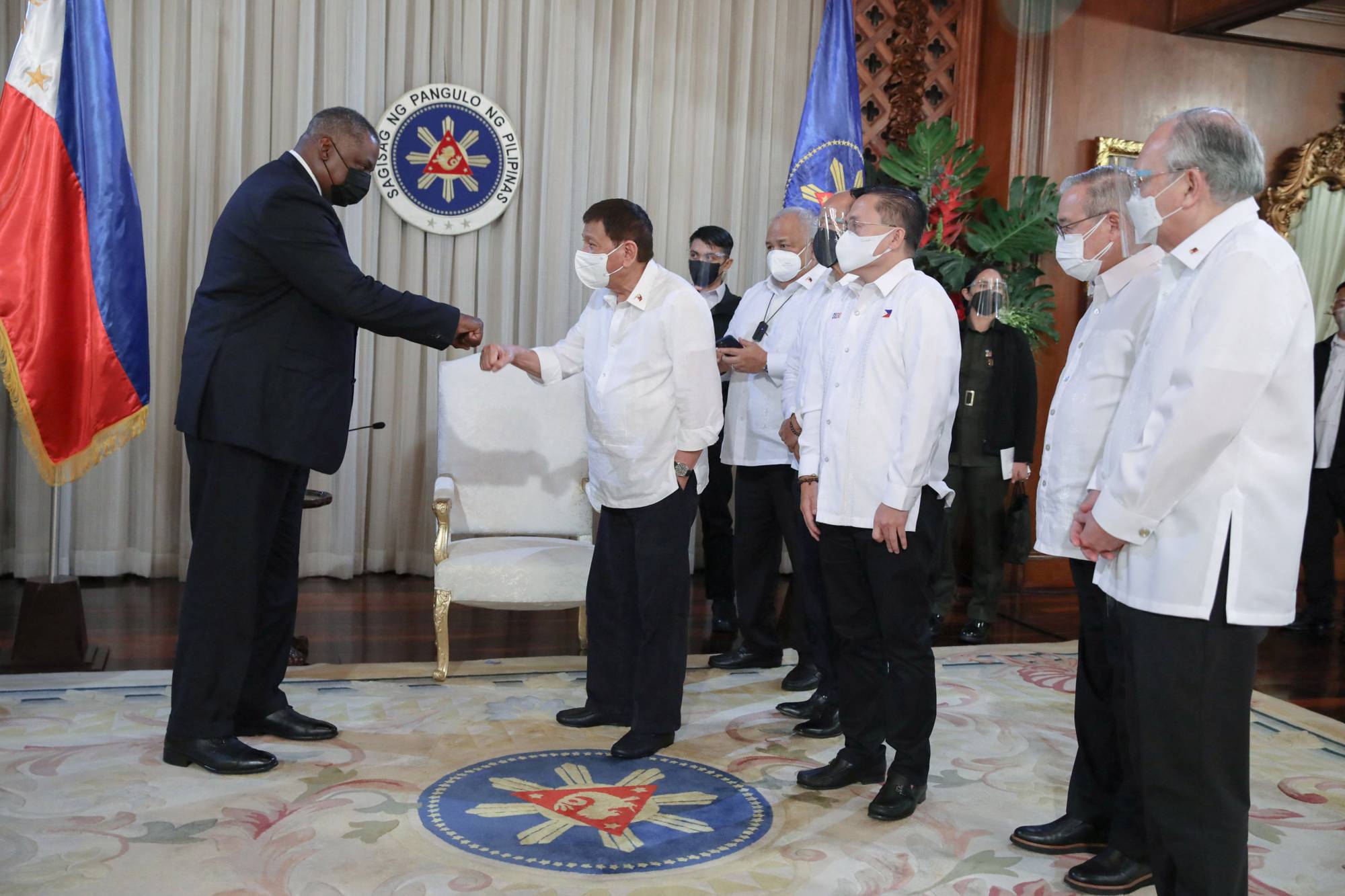 Philippine President Rodrigo Duterte greeting US Secretary of Defense Lloyd Austin during a courtesy call at Malacanang Palace in Manila