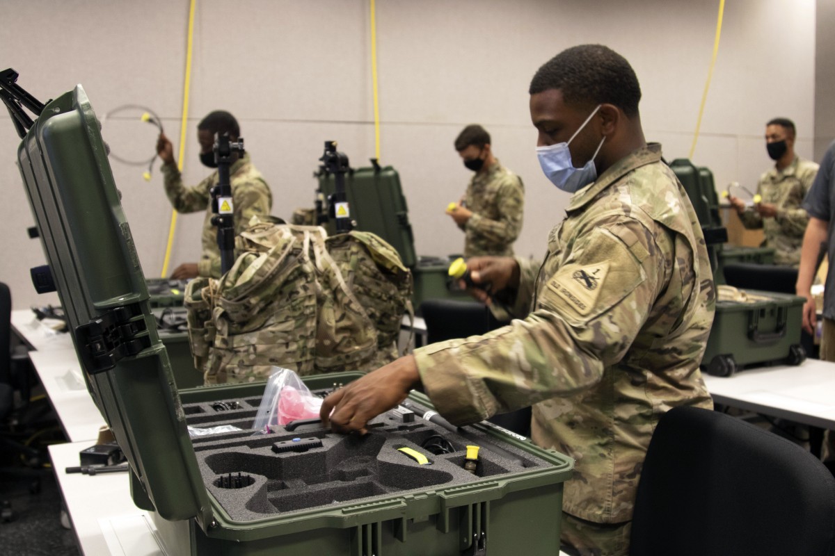 An Electronic Warfare Specialist in 1st Armored Division inventories assets for the VMAX dismounted Electronic Warfare system