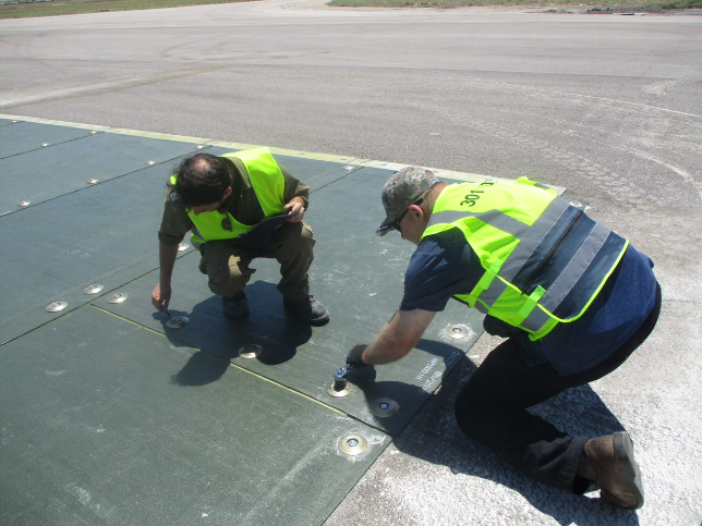 US and Israeli engineers repair a crater using Fiber Reinforced Polymer, or FRP, mats and anchoring systems. 