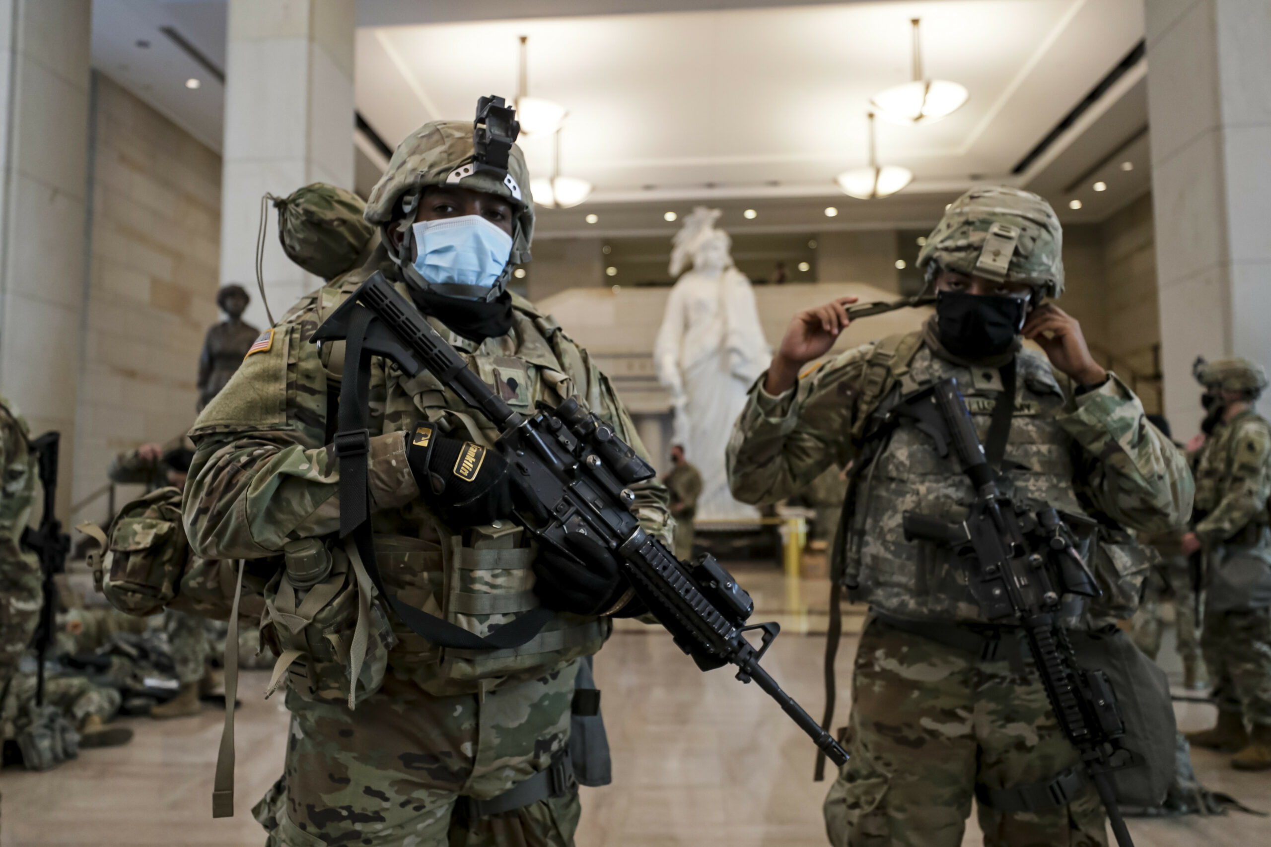 Virginia National Guard Soldiers prepare their gear for after resting in the Visitor Center in the US Capitol in Washington, DC, January 2021