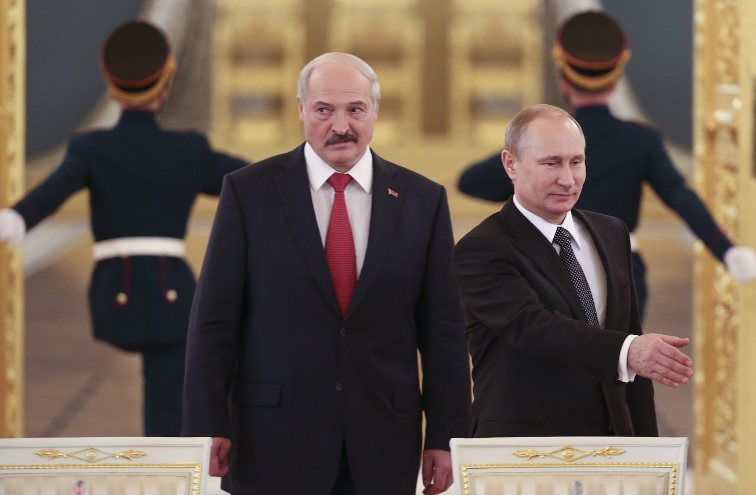 Russia's President Vladimir Putin and his Belarus' counterpart Alexander Lukashenko walk in as they attend a session of the Supreme State Council of the Union State at the Kremlin in Moscow on March 3, 2015.
