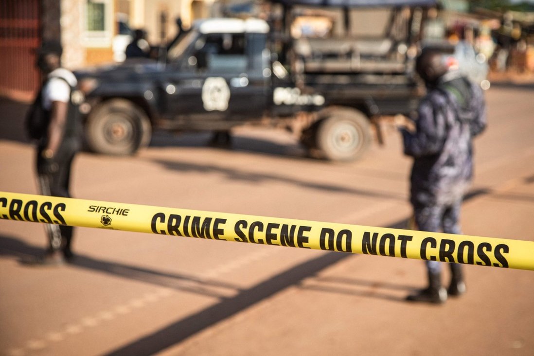 Ugandan police secure the crime scene on Sunday following a bomb blast in capital Kampala