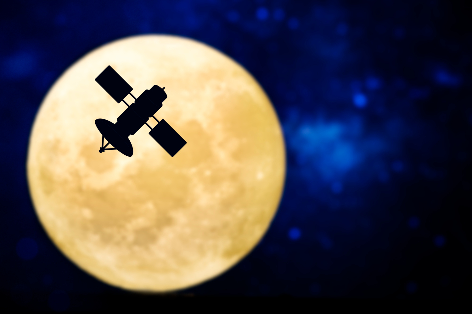 A satellite silhouette in front of a full moon