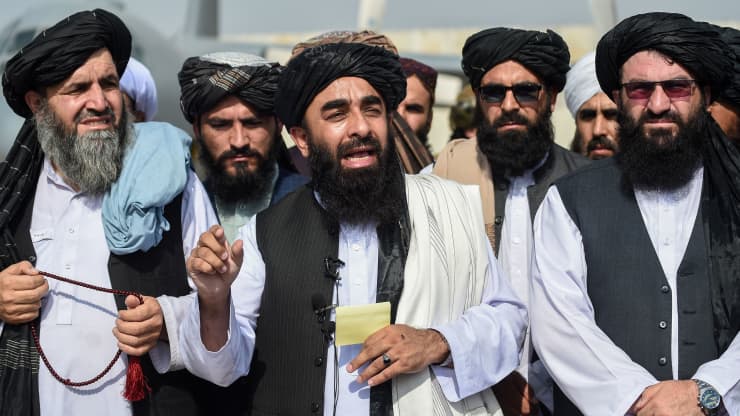Taliban spokesman Zabihullah Mujahid addresses a media conference
