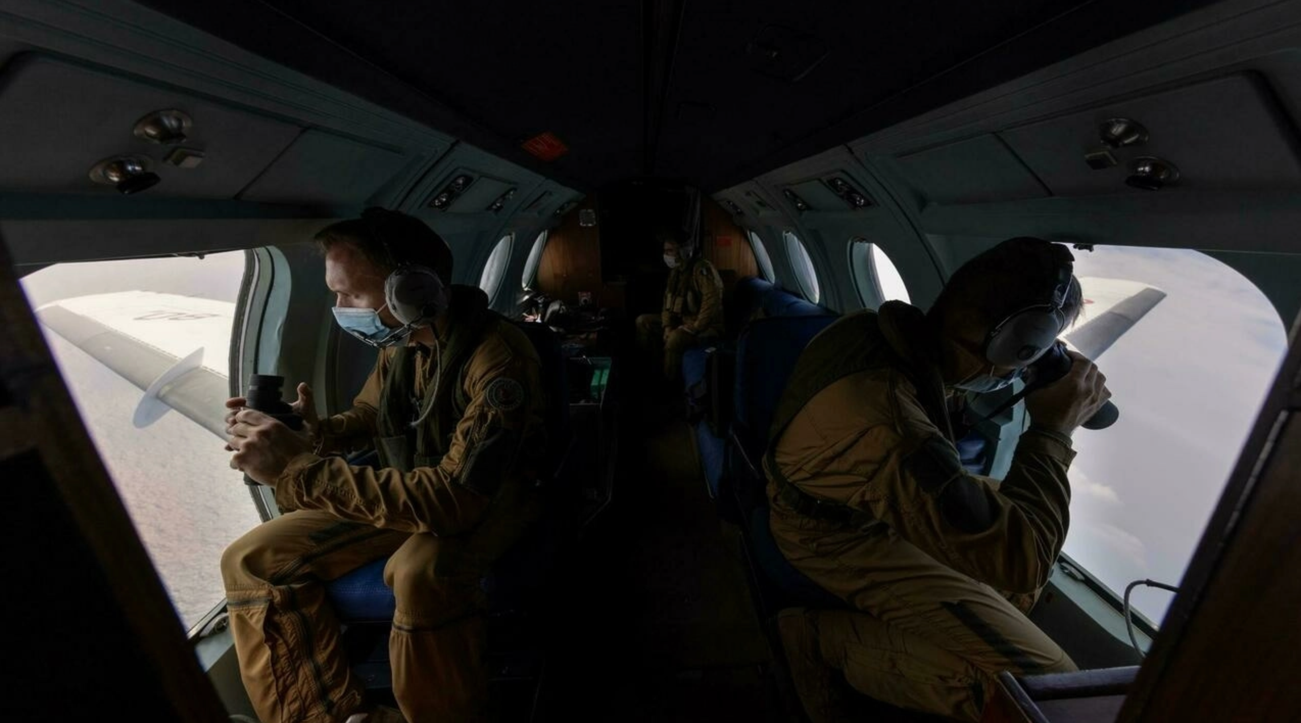 Flying above the Yellow Sea between Korea and China, a French naval crew scans the ocean surface for signs of contraband headed for North Korea