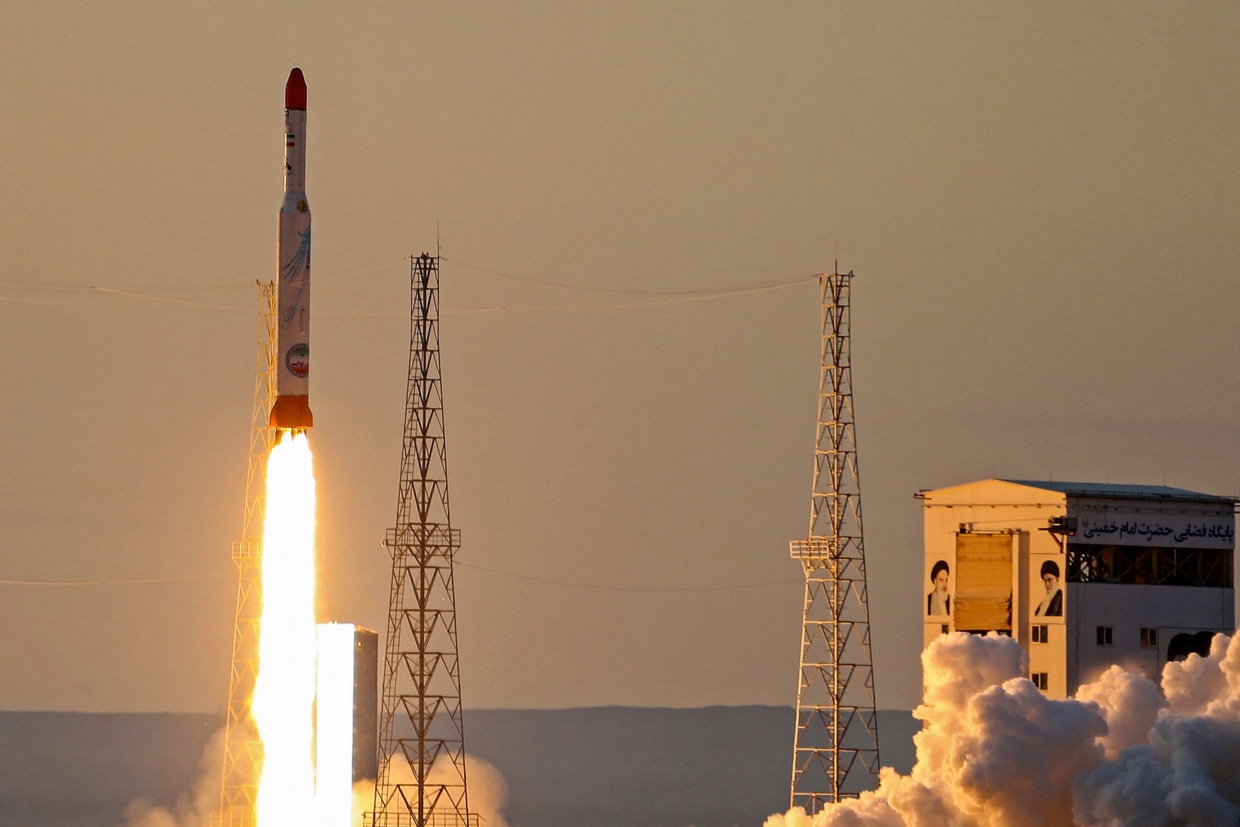 A handout picture released by Iran's Defense Ministry on December 30, 2021 shows a Simorgh satellite rocket lifting off during its launch at an undisclosed location in Iran