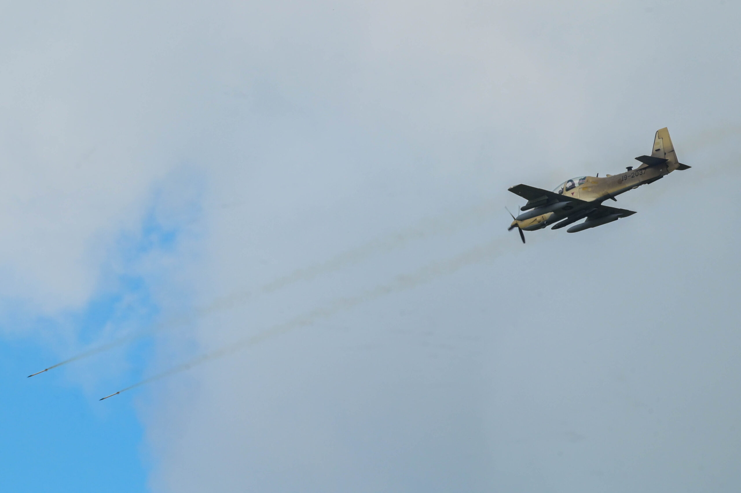 Nigerian Air Force A-29 Super Tucano aircraft pilot launches a Hydra 70 rocket