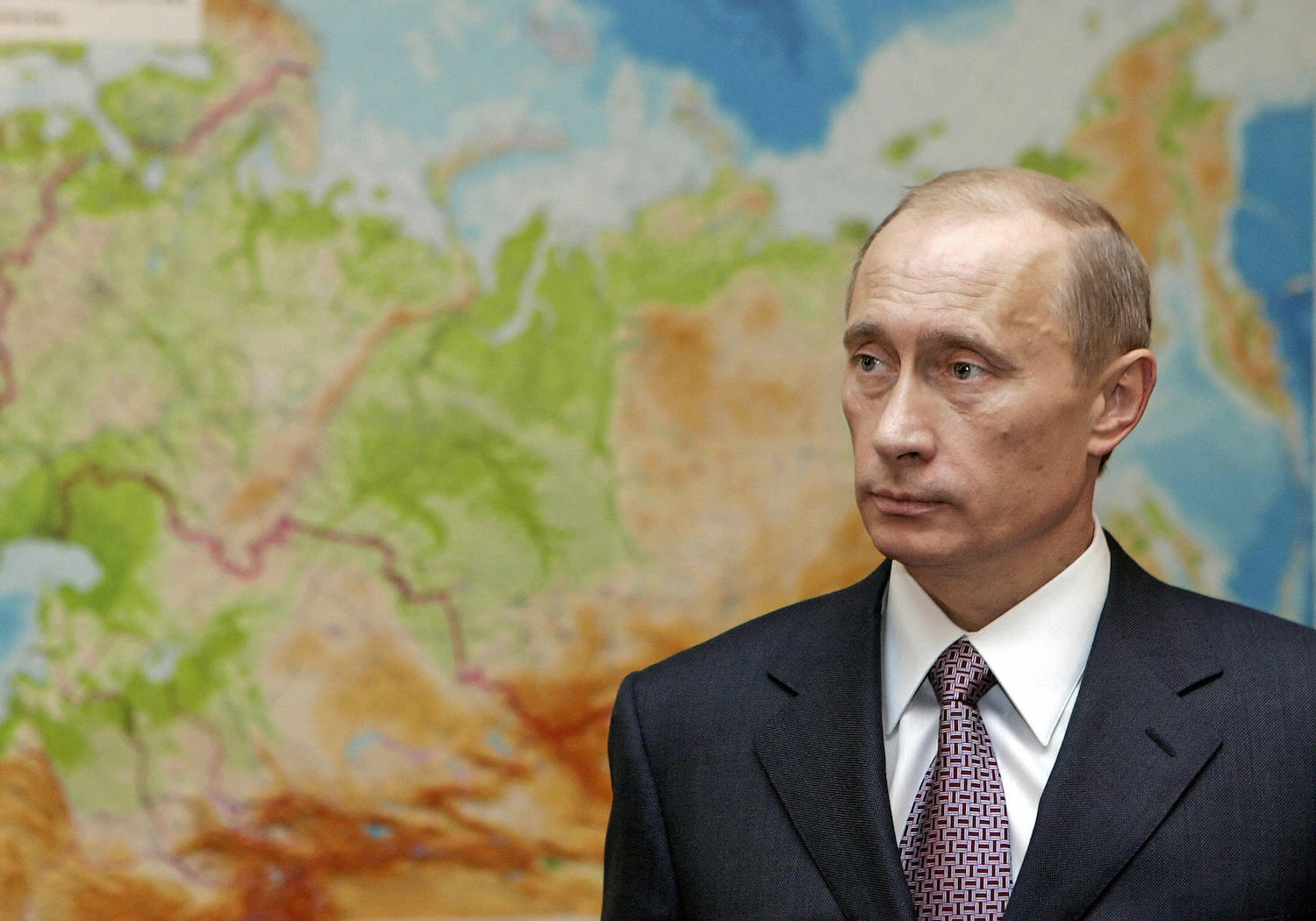 Russian President Vladimir Putin in front of a map in 2006