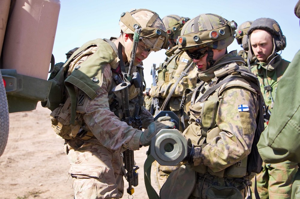 American soldier shows soldier from the Finnish Army an AT-4 anti-armor weapon
