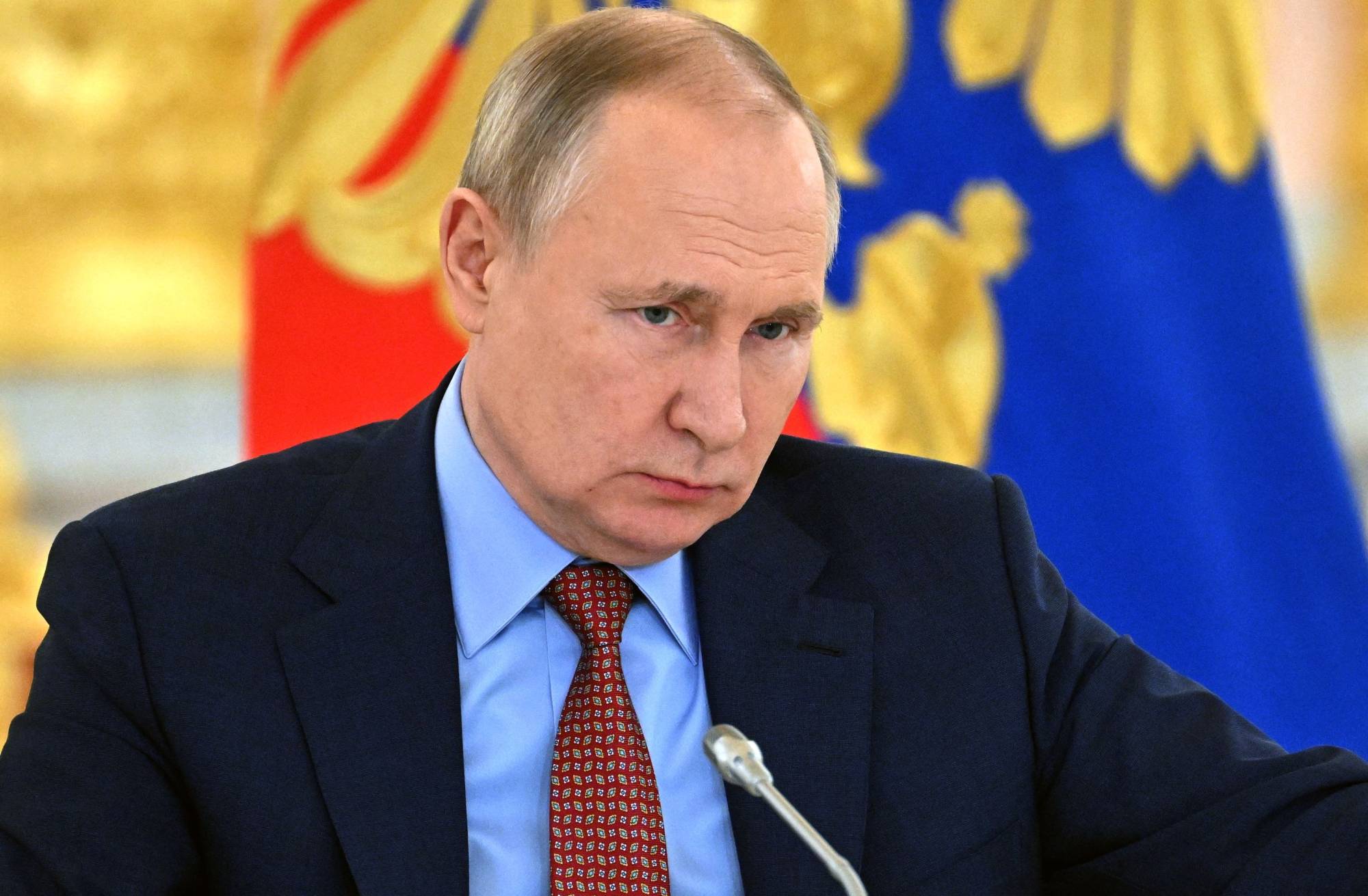 Russian President Vladimir Putin attends a meeting