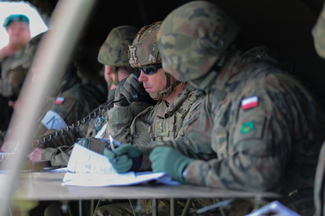 US Army major communicating during DEFENDER 2022 exercise in Poland