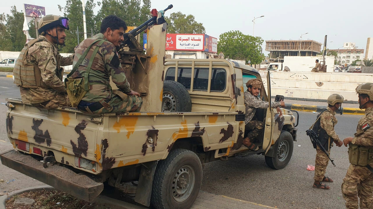 Southern Yemeni fighters deploy around the site of an explosion in the port city of Aden