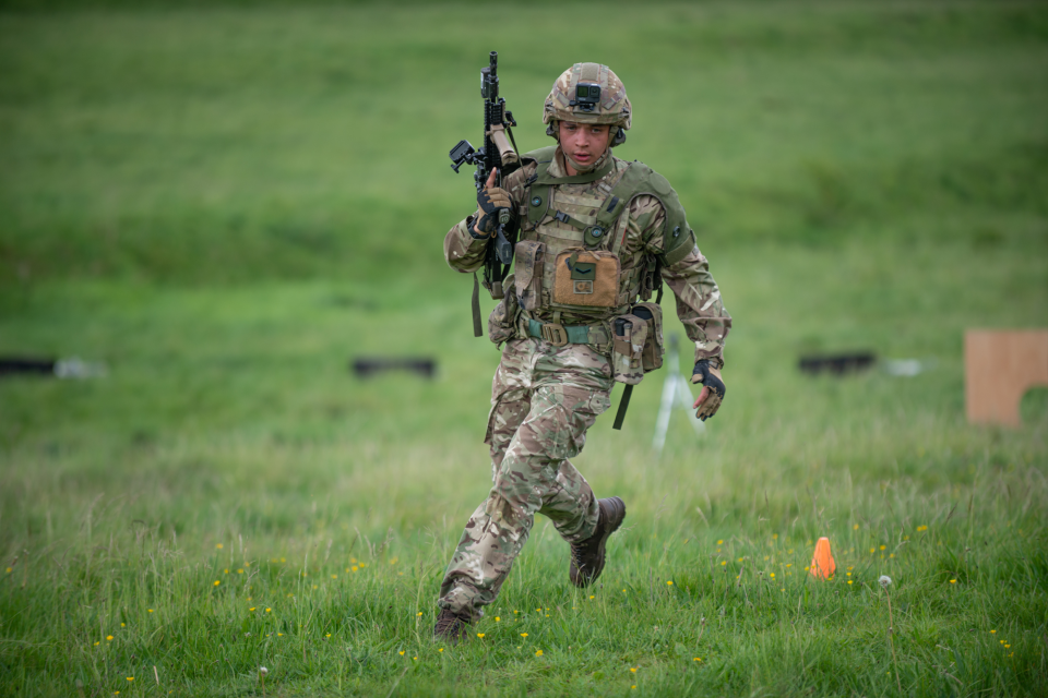A soldier from 5th Battalion, The Rifles, runs the obstacle course