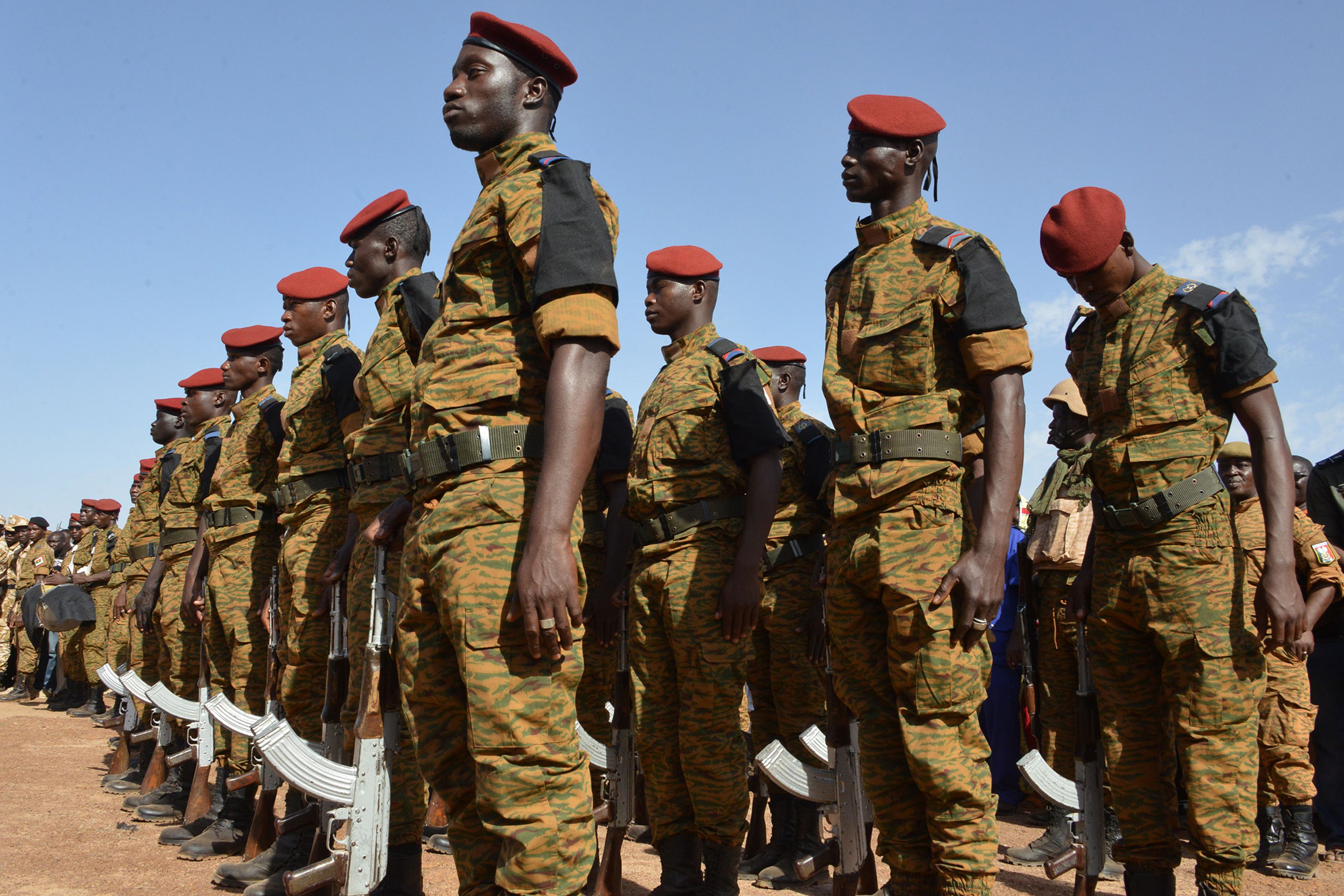 Burkinabe soldiers stand in line