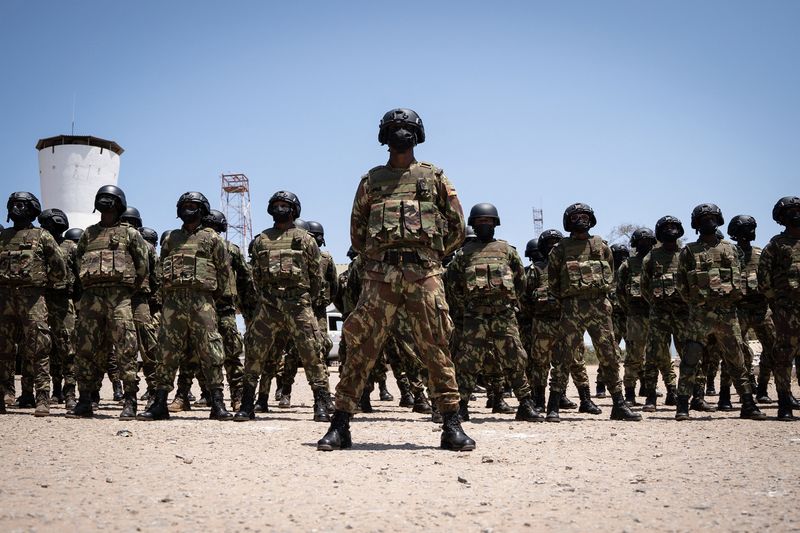 Mozambican soldiers stand at attention