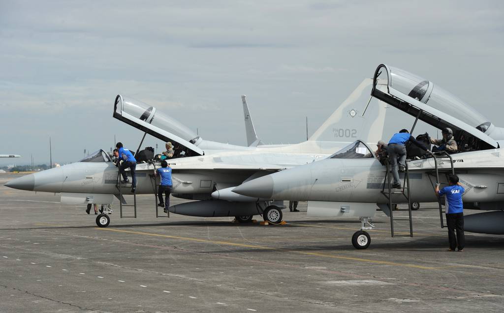Korea Aerospace Industries ground crew inspect FA-50 multirole light fighter aircraft.