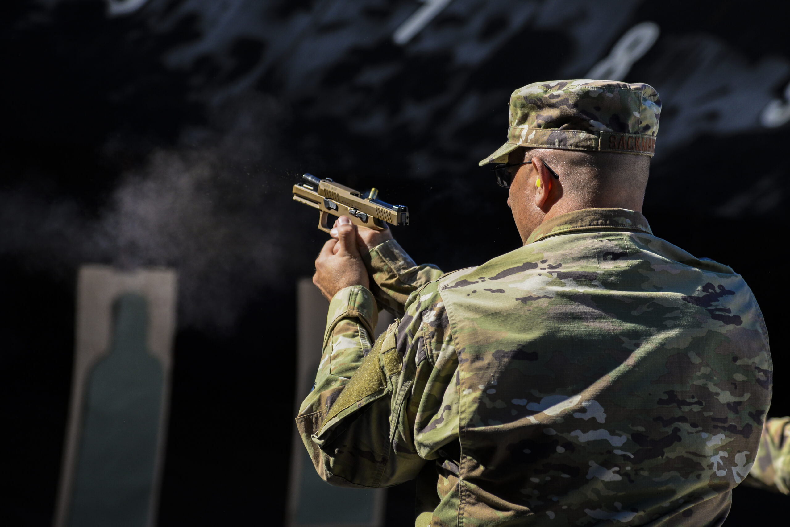USAF Col. Raymond A. Sackman fires SIG Sauer P320-M18 handgun.