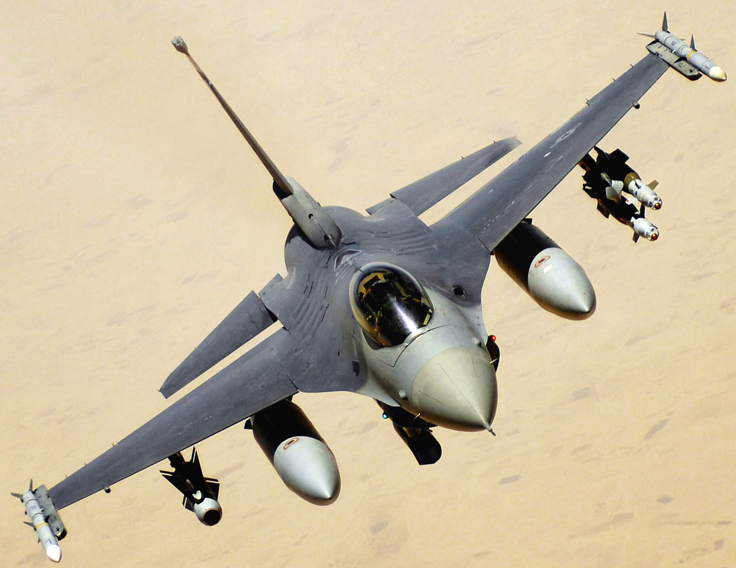 An F-16 Fighting Falcon aircraft returns to the fight after receiving fuel