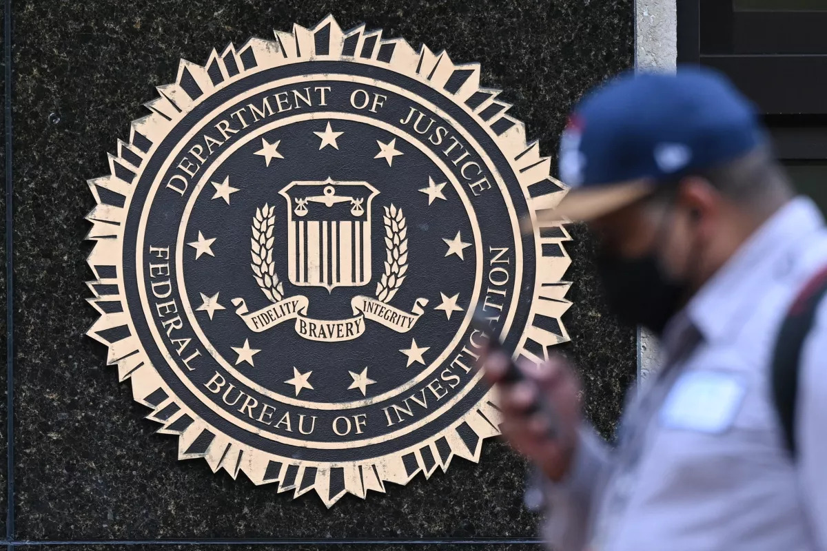 A pedestrian walks past the J. Edgar Hoover FBI building in Washington