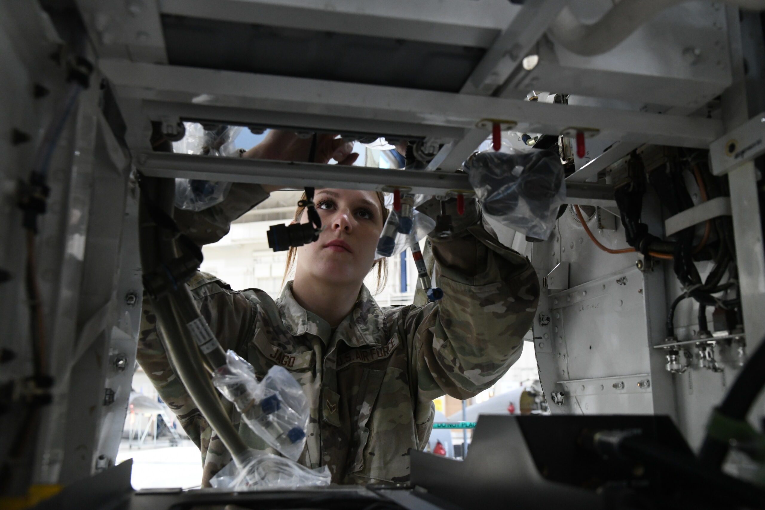 An Aircraft Integrated Avionics specialist assigned to the 148th Fighter Wing, Minnesota Air National Guard installs the active electronic scanned array (AESA) radar on an F-16 Fighting Falcon on November 8, 2022 at the Duluth Air National Guard Base, Minnesota. In addition to the AESA radar upgrade, the 148th fleet is undergoing a dozen structural and strengthening modifications through the F-16 service life extension program (SLEP). (U.S. Air National Guard photo by Audra Flanagan)