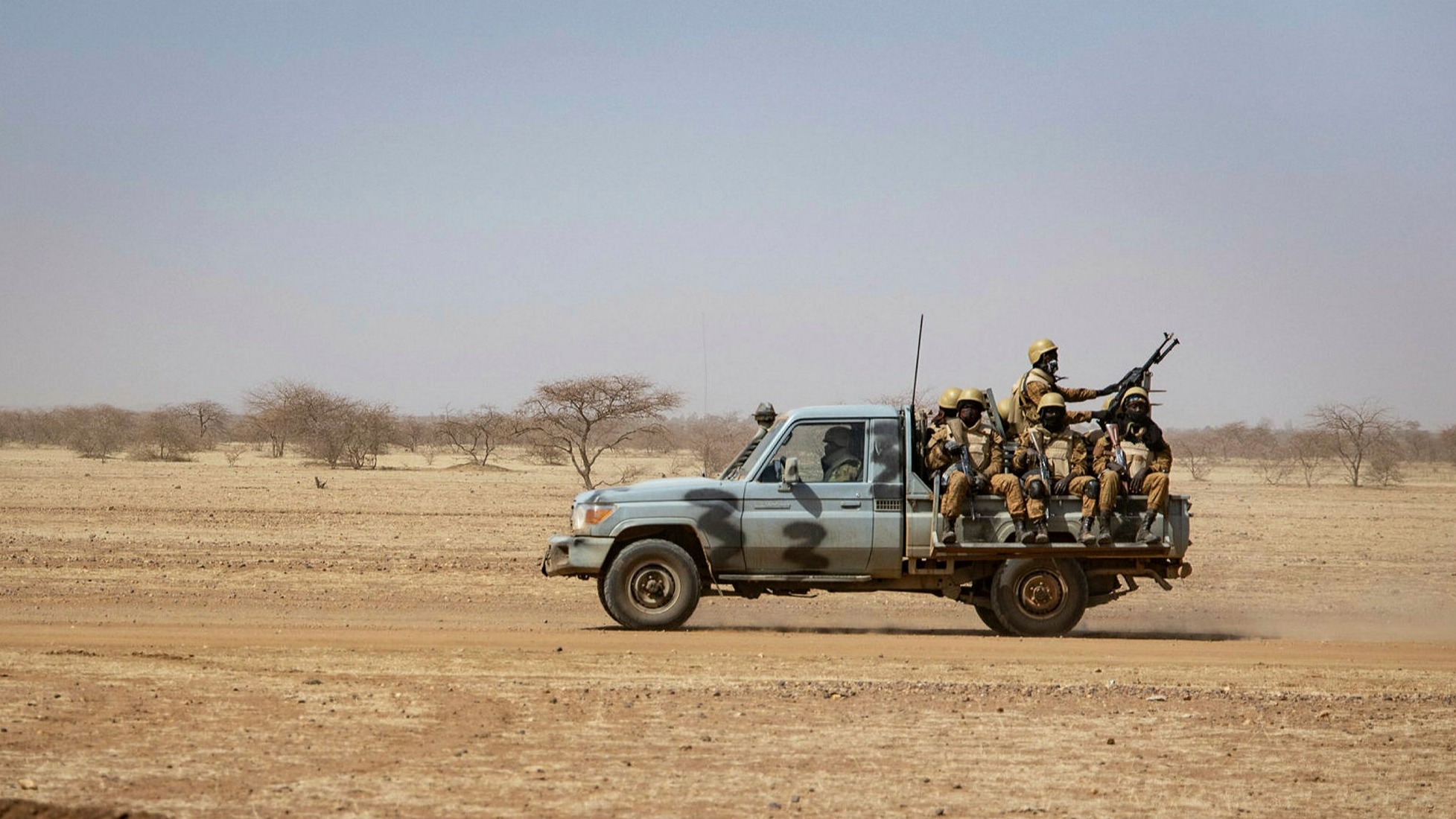Burkinabe soldiers aboard a military vehicle
