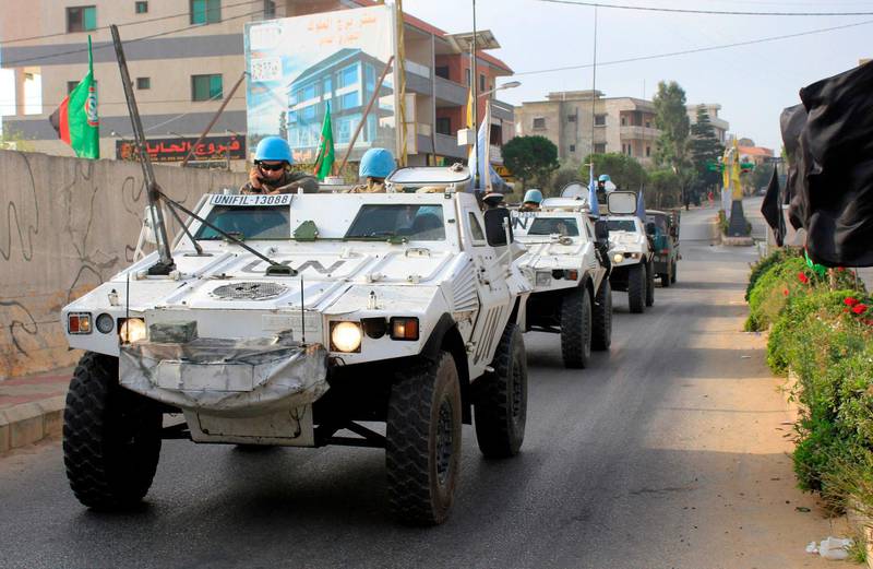 Soldiers for the United Nations Interim Forces in Lebanon patrol the southern Lebanese village of Kfar Kila along the border with Israel