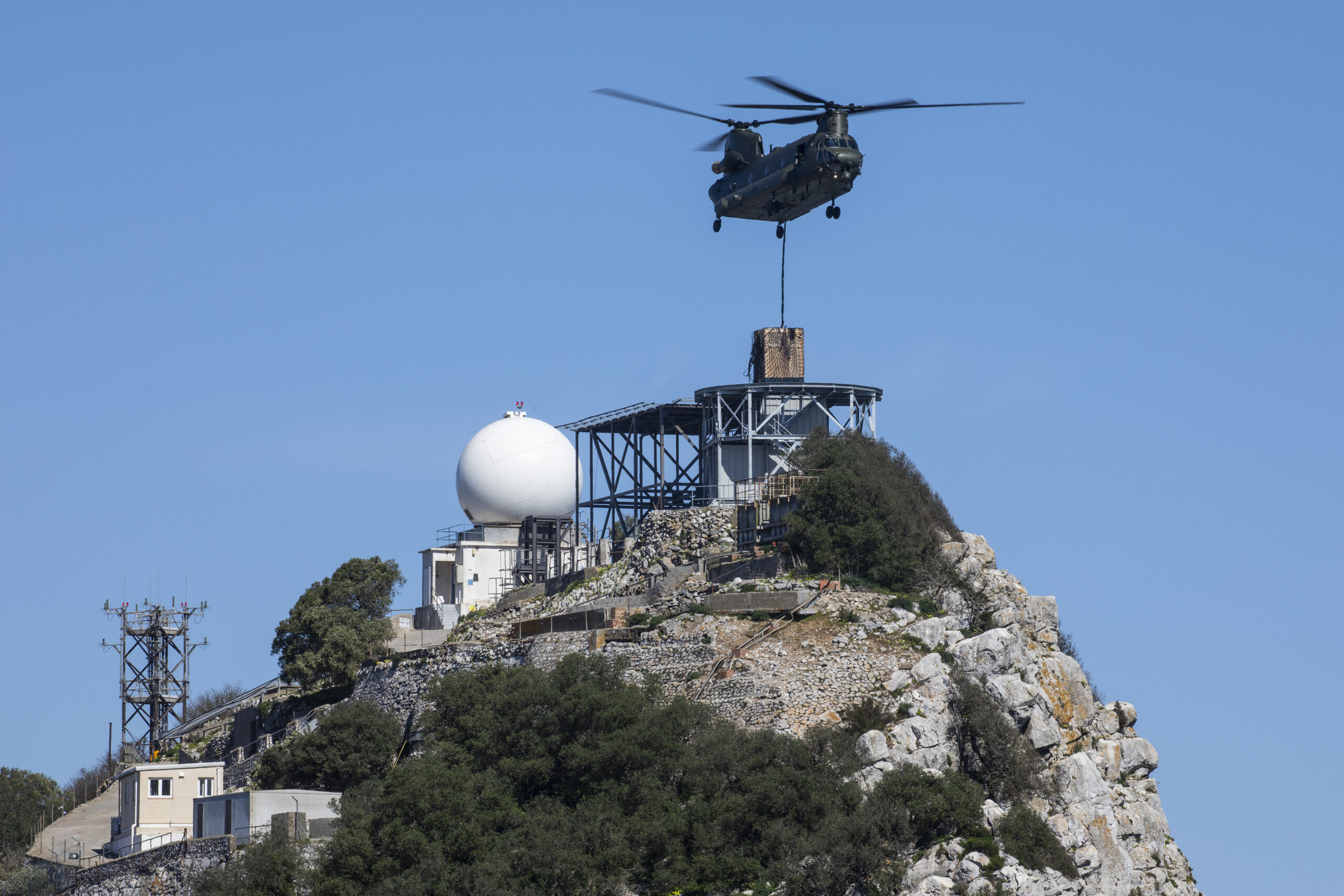 A RAF Odiham Chinook delivers radar equipment to the top of the Rock of Gibraltar.
