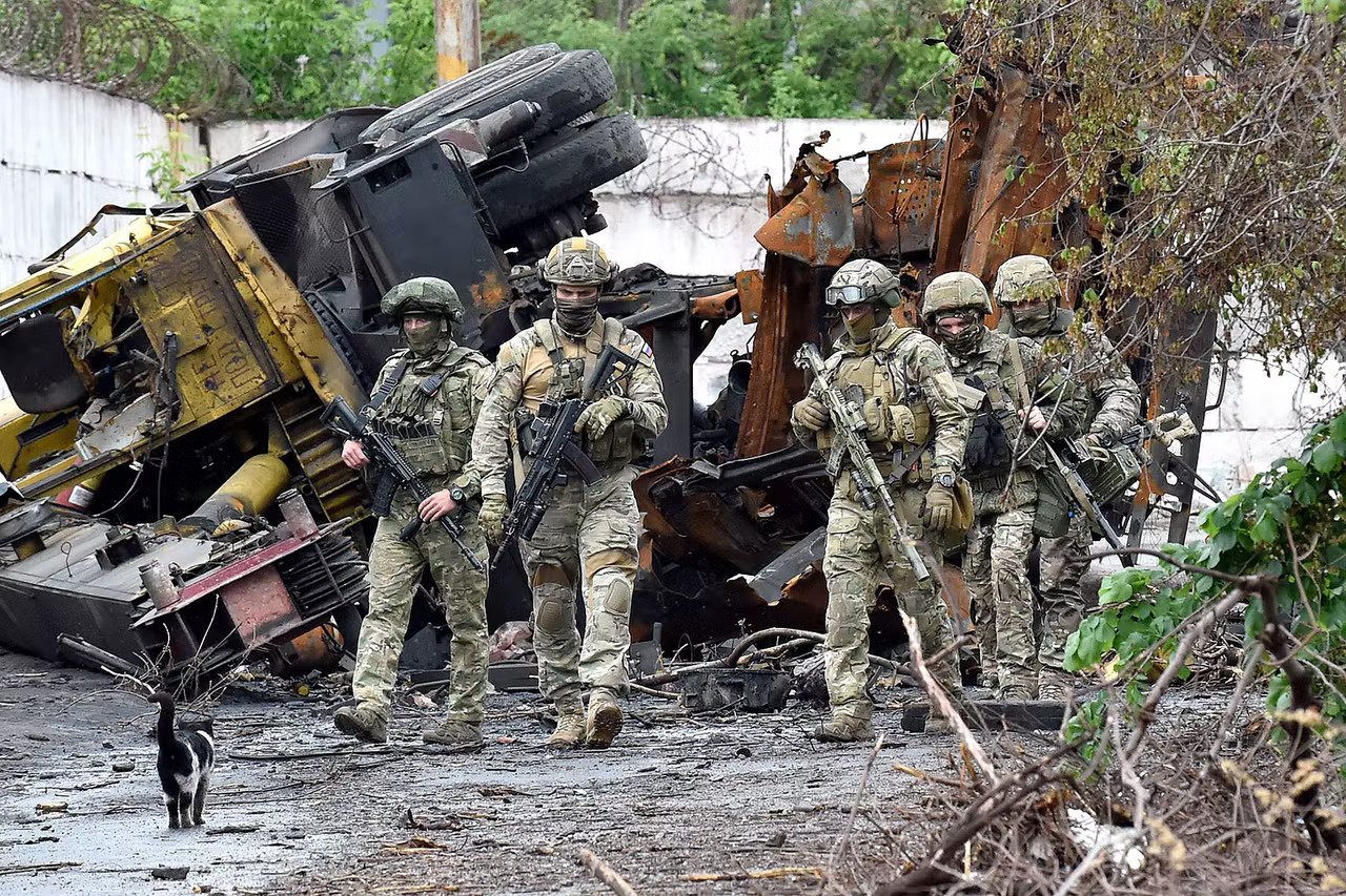 Russian servicemen patrol the destroyed part of the Ilyich Iron and Steel Works in Ukraine’s port city of Mariupol