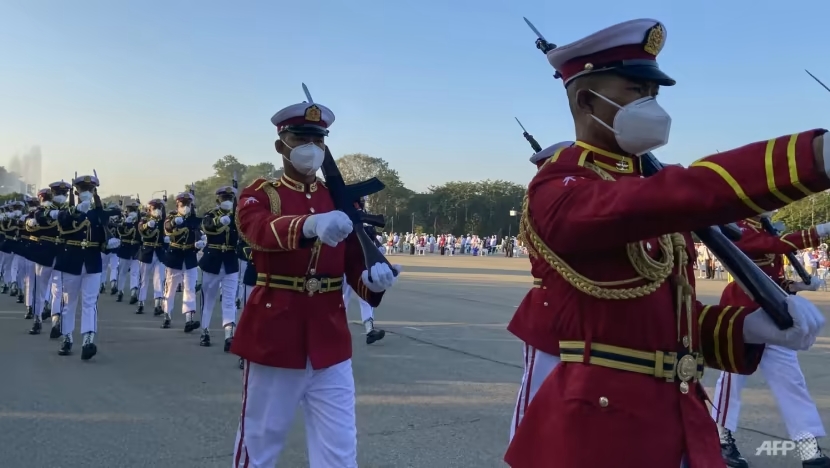 Members of a Myanmar military honour guard take part in a ceremony to mark Myanmar's 74th Independence Day