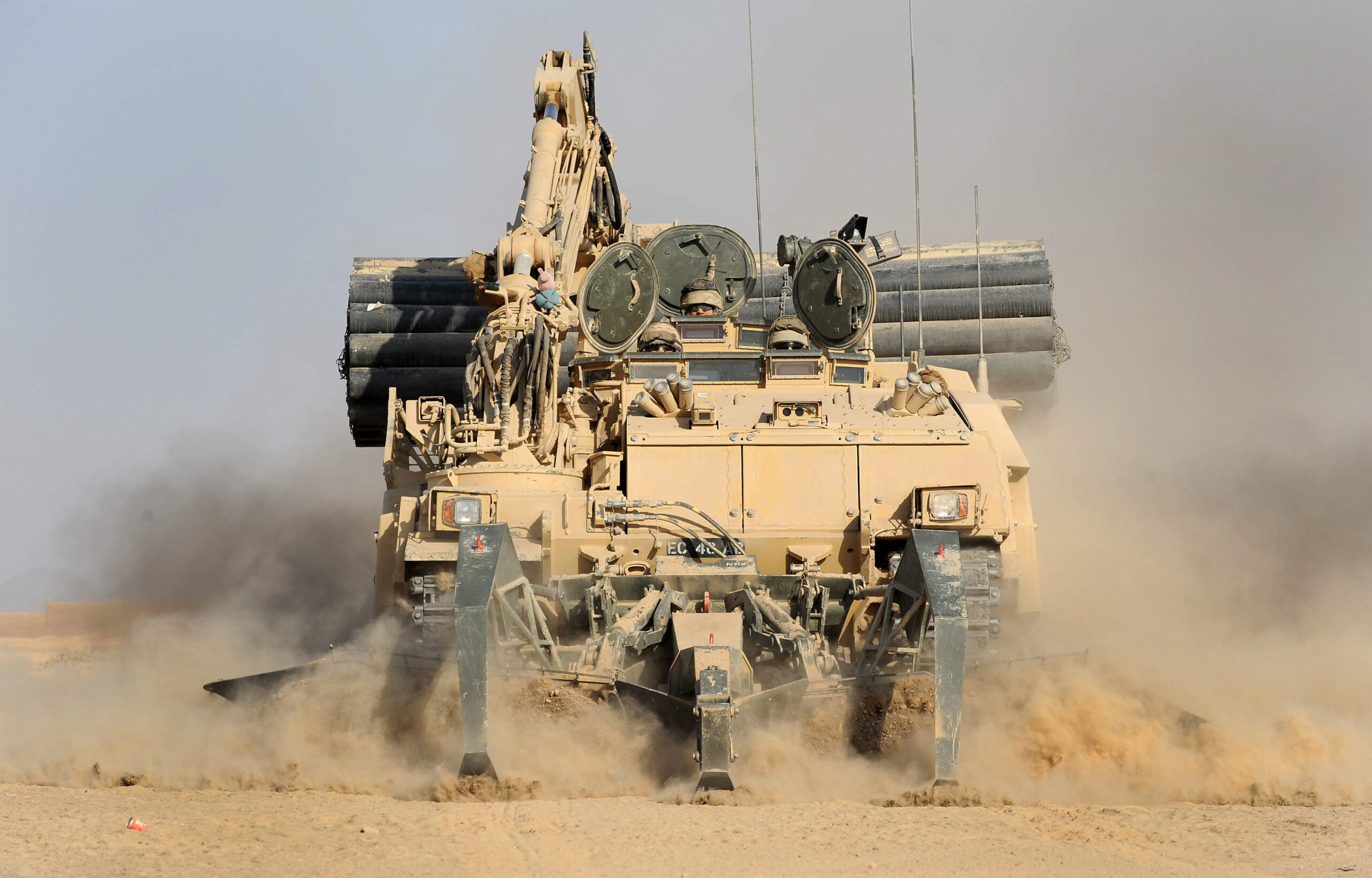A mighty Trojan Tank belonging to 5 Armoured Engineer Squadron, cuts through the sand on Operation Hamkari in Afghanistan. The AVRE (Armoured Vehicle Royal Engineers) is used in conjuction with other vehicles and the Python weapon system for clearing IEDs (Improvised Explosive Devices). The bulk of British military operations in Afghanistan are concentrated in central Helmand. But Royal Engineers have spent the past two months lending their awesome capabilities to Afghan and US forces clearing a key area of Kandahar province. Since September, 5 Armoured Engineer Squadron, part of 23 Engineer Regiment (Air Assault), have provided close engineering support to the 2nd Battalion of the US ArmyÕs 502nd Regiment, and their partnered Afghan National Army kandak, in KandaharÕs Zharay district. Zharay district contains the Horn of Panjwai, an insurgent stronghold from where attacks on Kandahar City have been enabled and supported, and Sangsar, the Taleban's spiritual birthplace and former home of Mullah Omar. Under this effort, known as Operation HAMKARI - or as the soldiers call it 