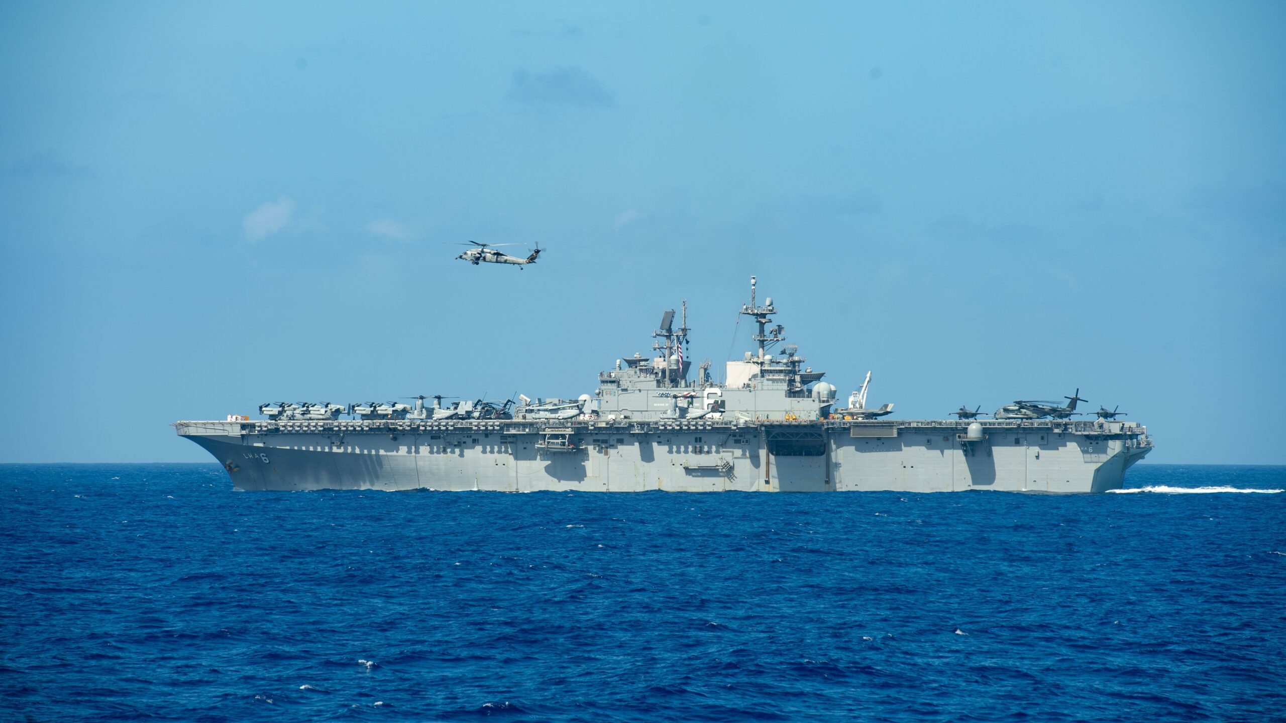 PACIFIC OCEAN (Feb. 15, 2020) The amphibious assault ship USS America (LHA 6) transits the Pacific Ocean Feb. 15, 2020. Operating as an Expeditionary Strike Force, the Navy-Marine Corps team integrates the combat power of the Theodore Roosevelt Carrier Strike Group with the flexible capability of the America Expeditionary Strike Group to provide the fleet commander with a capable, credible combat force that can be deployed anywhere in the world. (U.S. Navy photo by Mass Communication Specialist 3rd Class Nicholas V. Huynh)