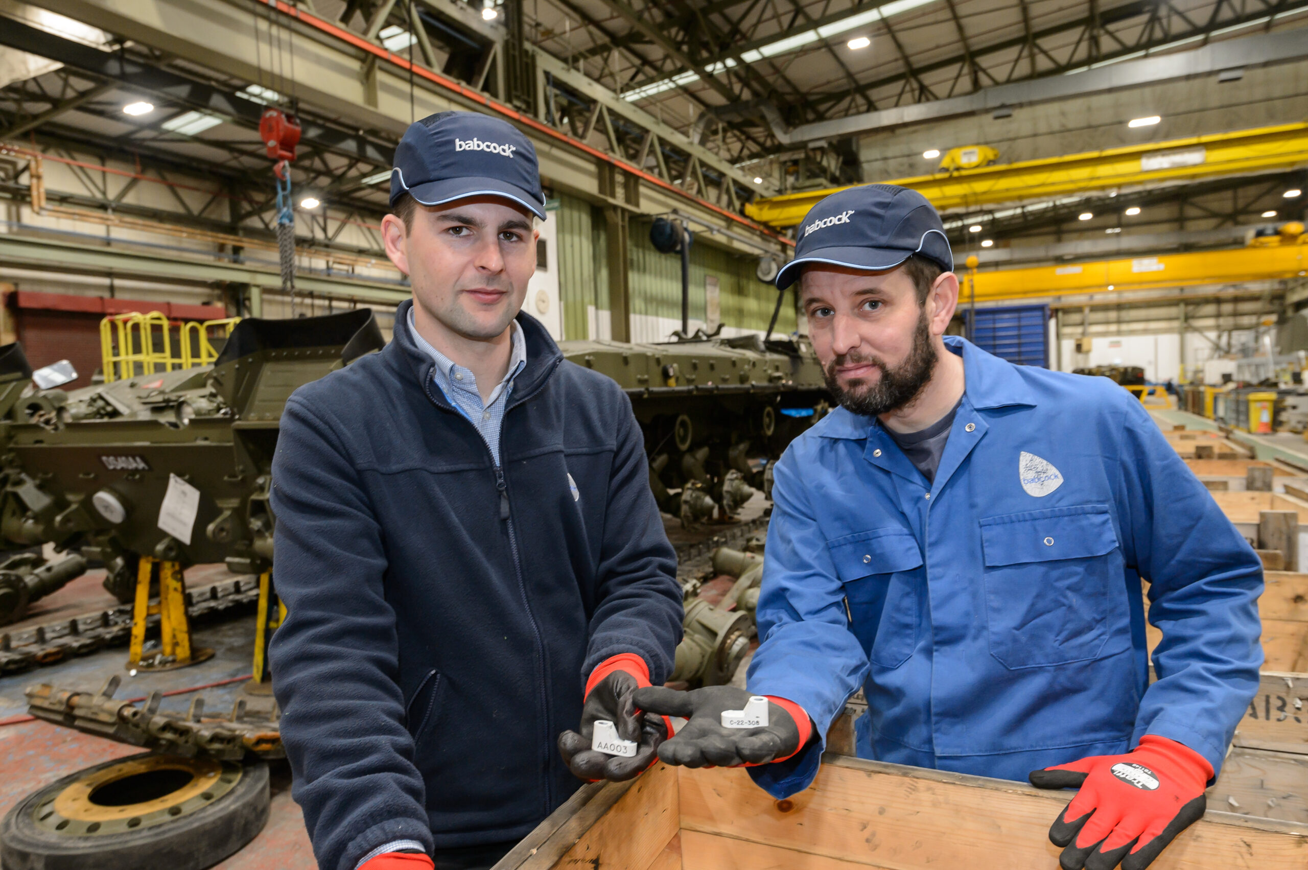 Babcock experts with 3D-printed metal parts for British armored fleet