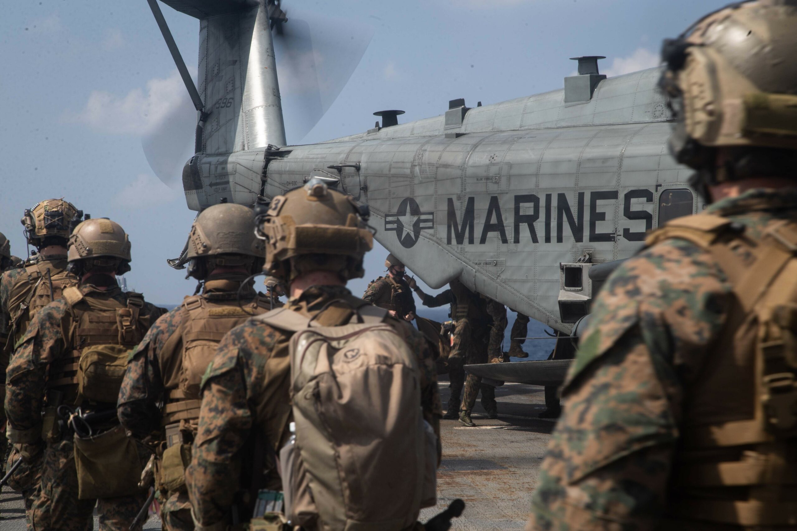 US Marines exfiltrate towards a CH-53E Super Stallion during a simulated visit, board, search, and seizure mission aboard dock landing ship USS Germantown in the South China Sea, 2020