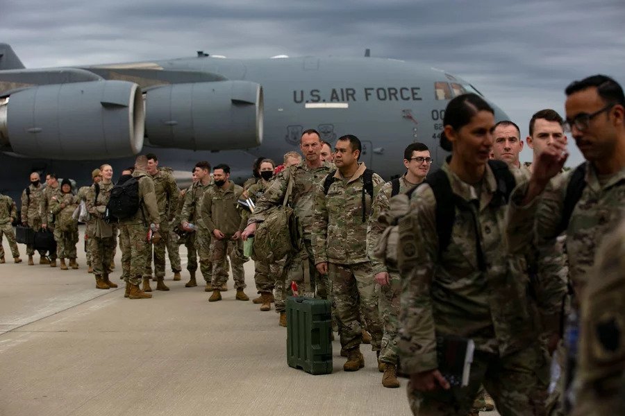 US troops deploy for Europe from Pope Army Airfield at Fort Bragg, N.C.