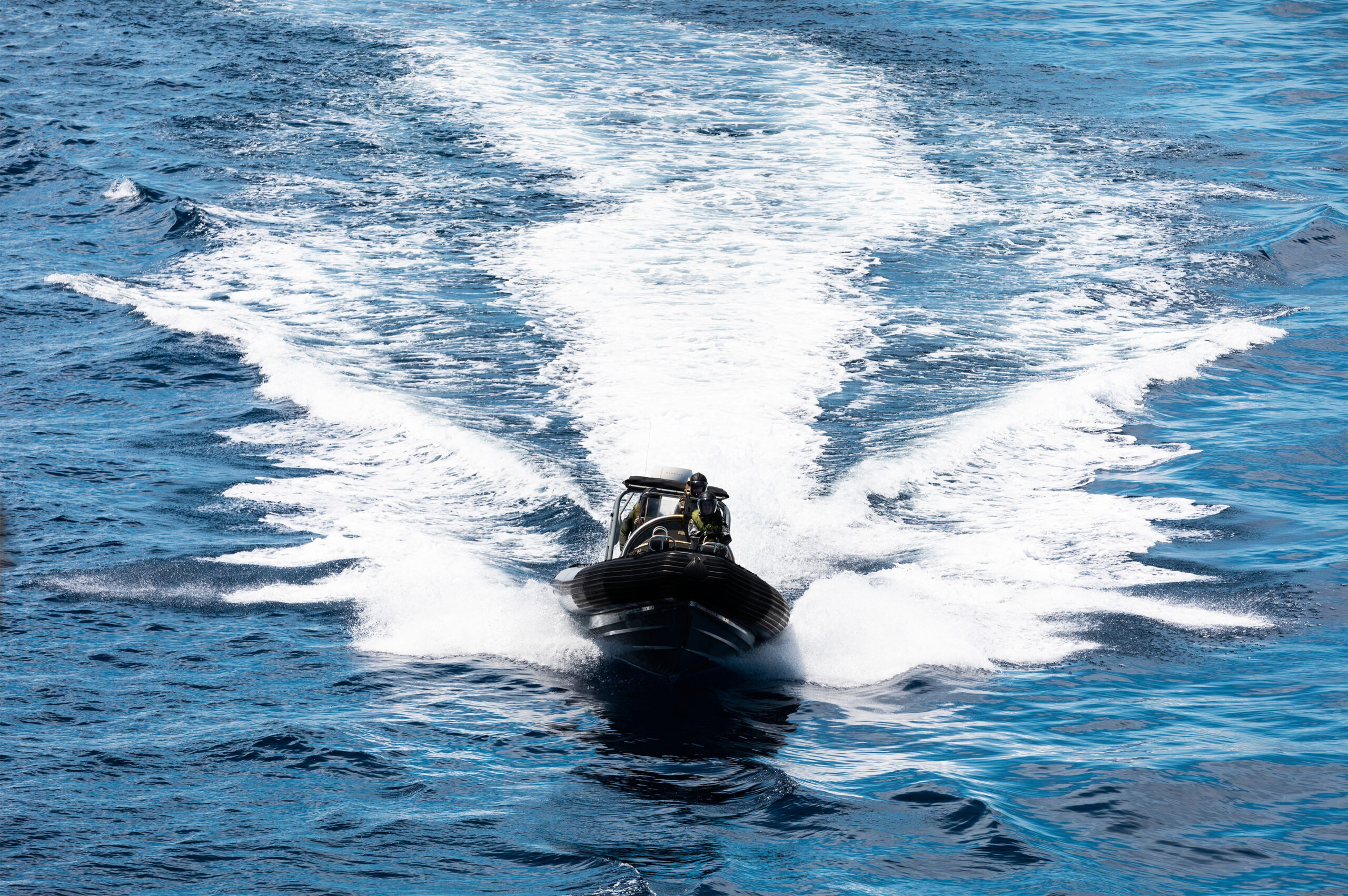 HMAS Hobart's rigid hull inflatable boat (RHIB) returns to the ship on completion of a passenger transfer with HMAS Stalwart as the ships transit through the Indonesian Archipelago during a regional presence deployment. *** Local Caption *** Three Royal Australian Navy ships are currently conducting a regional presence deployment through the Indo-Pacific region. During their deployments HMA Ships Hobart, Stalwart, and Arunta will undertake exercises and engagements with Australia's regional partners. The ships will also conduct engagements as part of Indo-Pacific Endeavour 2022, in the Philippines, Thailand and Timor-Leste. Regional presence deployments demonstrate Australia's commitment to and engagement with the region. These deployments play a vital role in Australia's long term security and prosperity by protecting Australia's interests, preserving a rules-based order, enhancing cooperation and relationships with regional partners and allies, and developing capability and interoperability.