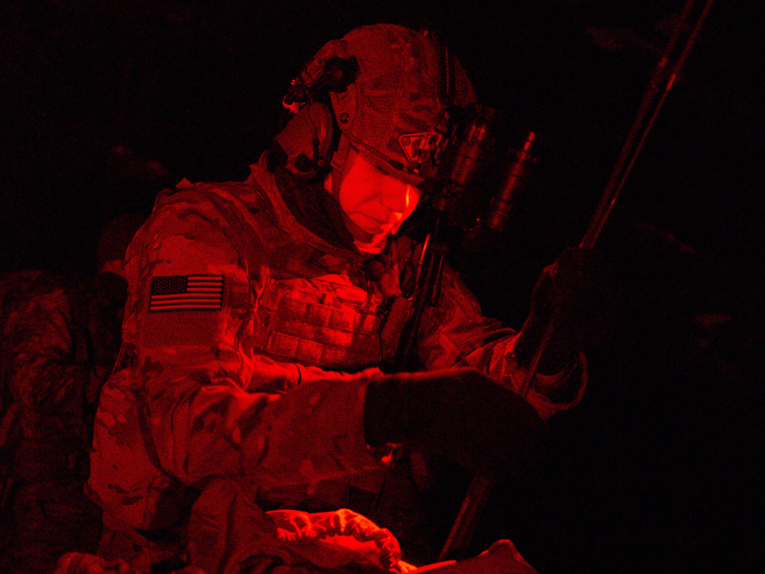 Tactical air control party personnel setting field radio antenna