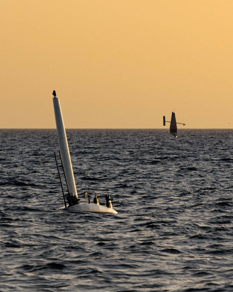 230216-N-NO146-1001 ARABIAN GULF (Feb. 16, 2023) An Ocean Aero Triton unmanned surface vessel (USV), left, operates in the Arabian Gulf with a Saildrone Explorer USV during a bilateral exercise between the U.S. Navy and United Arab Emirates Navy, Feb. 16, 2023. (U.S. Navy photo by Lt. Jay Faylo)