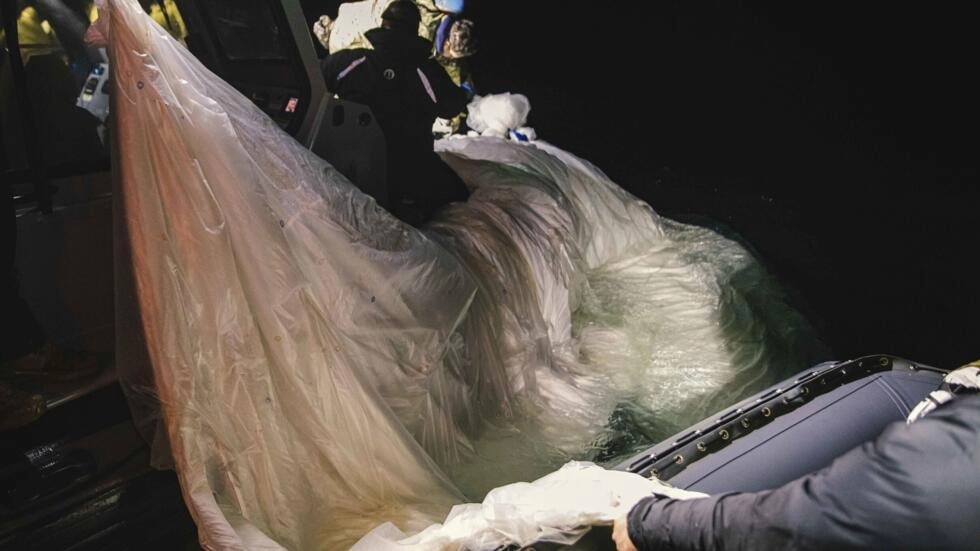 US sailors assigned to Explosive Ordnance Disposal Group 2 recover a high-altitude surveillance balloon off the coast of Myrtle Beach, South Carolina, in the Atlantic Ocean