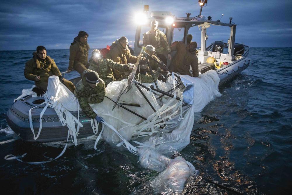 US Navy sailors recover a high-altitude surveillance balloon off the coast