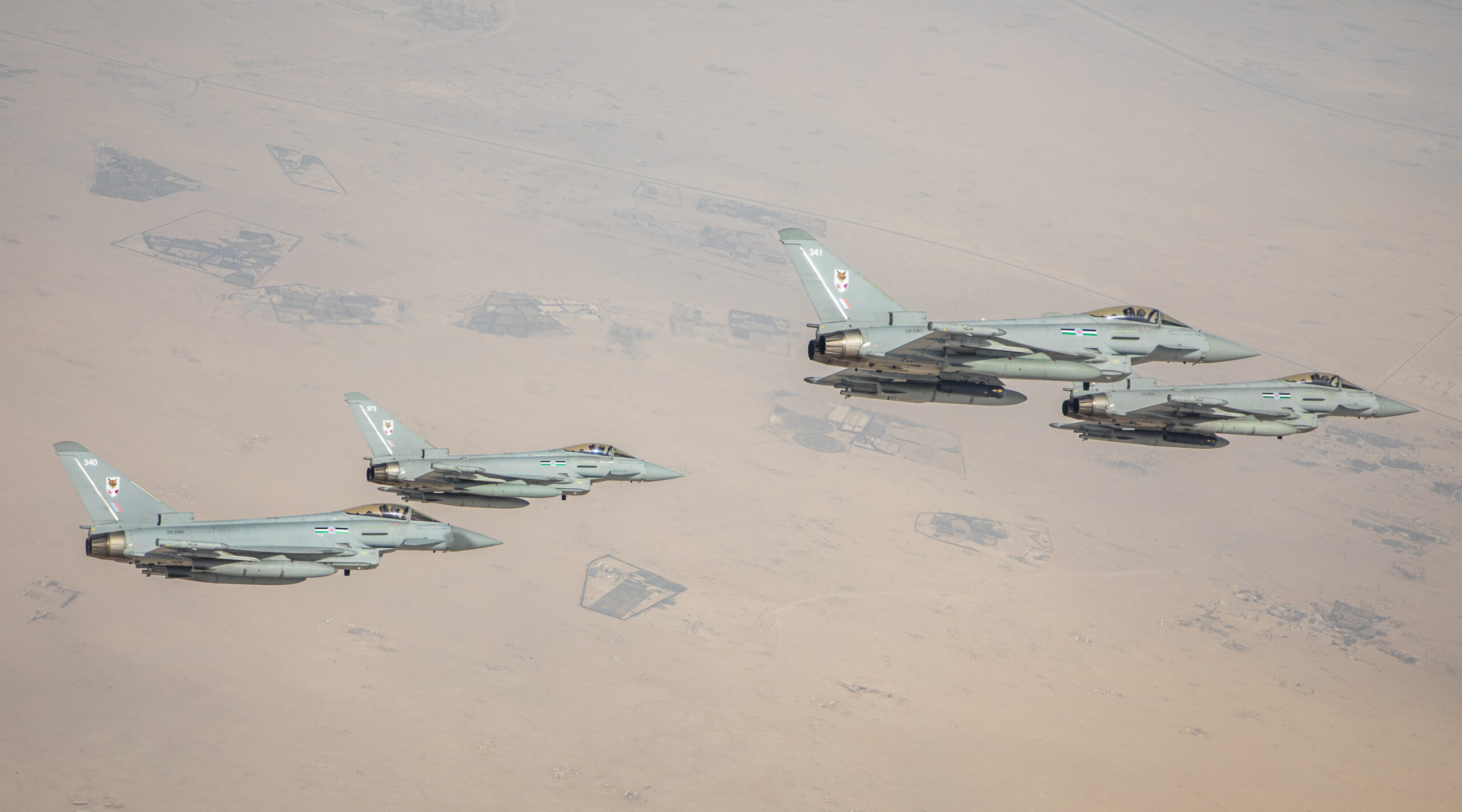 The Royal Air Force (RAF) and Qatar Emiri Air Force (QEAF) conducted a flypast over Doha today to celebrate the air defence partnership between both nations. The United Kingdoms Red Arrows joined QEAF and RAF Typhoon jets for an exciting flypast for spectators and senior representatives from both air forces gathered in Dohas harbour. The Red Arrows and Qatars aerobatic display team performed thrilling displays over the seafront. The RAF Typhoons were from 12 Squadron, the joint UK-Qatar Typhoon squadron, which is currently deployed to Qatar to support the formation of the QEAFs first Typhoon squadron and to support air security operations for the upcoming FIFA World Cup. Typhoons from 7 Squadron, the QEAFs first Typhoon squadron, flew alongside the RAF in the flypast. To successfully form 7 Squadron, the two air forces are collaborating in Qatar to apply the knowledge gained while working together on the joint Typhoon squadron at RAF Coningsby.