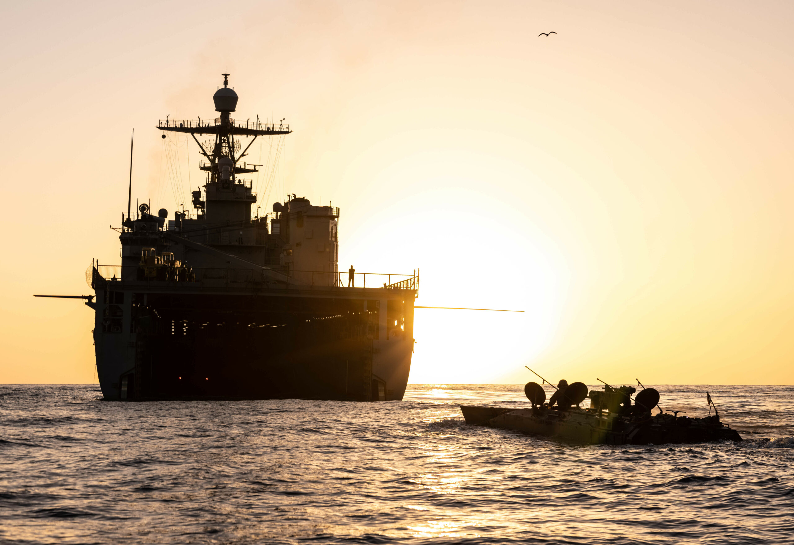 A U.S. Marine Corps Amphibious Combat Vehicle with 3rd Assault Amphibian Battalion, 1st Marine Division, moves toward the USS Harpers Ferry during Steel Knight 23 off the coast of Marine Corps Base Camp Pendleton, California, Nov. 29, 2022. ACV’s are currently authorized to conduct waterborne operations in open and protected waters, while surf zone transit testing is ongoing. Steel Knight is an annual combined arms live-fire exercise which ensures 1st MARDIV is optimized for naval expeditionary warfare in contested spaces, and is purpose-built to facilitate future operations afloat and ashore. (U.S. Marine Corps photo by Cpl. Cameron Hermanet)