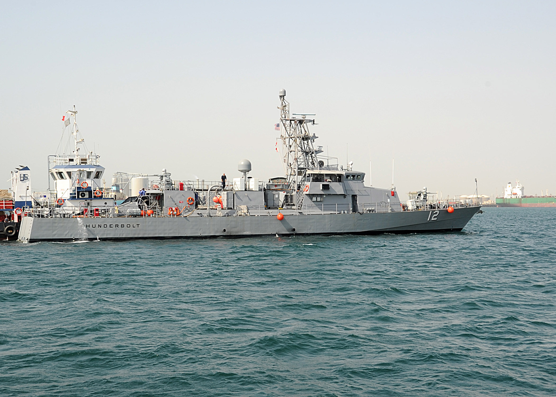 The coastal patrol ship USS Thunderbolt (PC 12) transits from Khalifa Bin Salman Port to Mina Salman Pier. The arrival of Thunderbolt, USS Tempest (PC 2) and USS Squall (PC 7) brings the total number to eight coastal patrol ships to support maritime security operations and theater security cooperation efforts in the U.S. 5th Fleet area of responsibility. (U.S. Navy photo by Mass Communication Specialist 1st Class Stephen Murphy/Released)