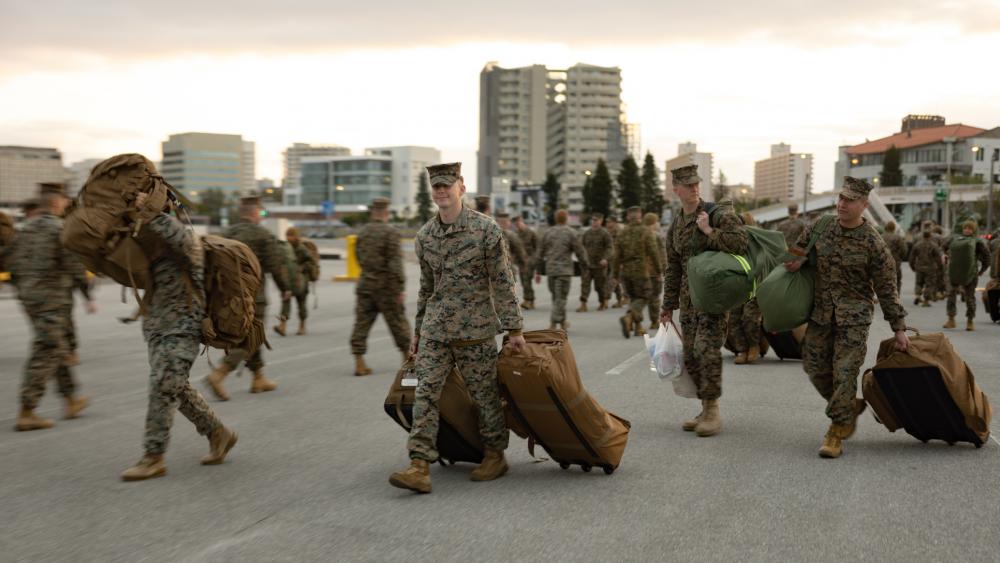 US Marines load the high-speed transport vessel USNS Guam (T-HST 1) at Naha Military Port, Okinawa, Japan, March 3, 2023 ahead of exercise Freedom Shield 23 in South Korea